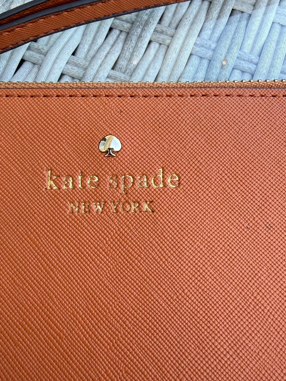 kate spade wristlet clutch in rust orange